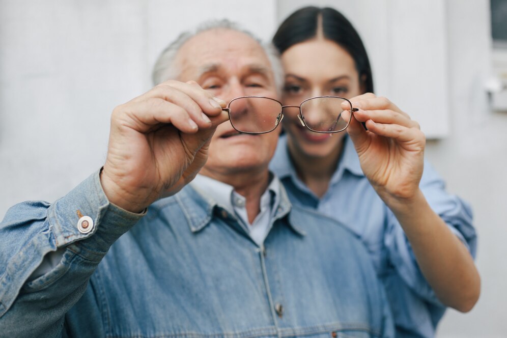 old-man-standing-gray-backround-with-his-granddaughter_1157-33035.jpg