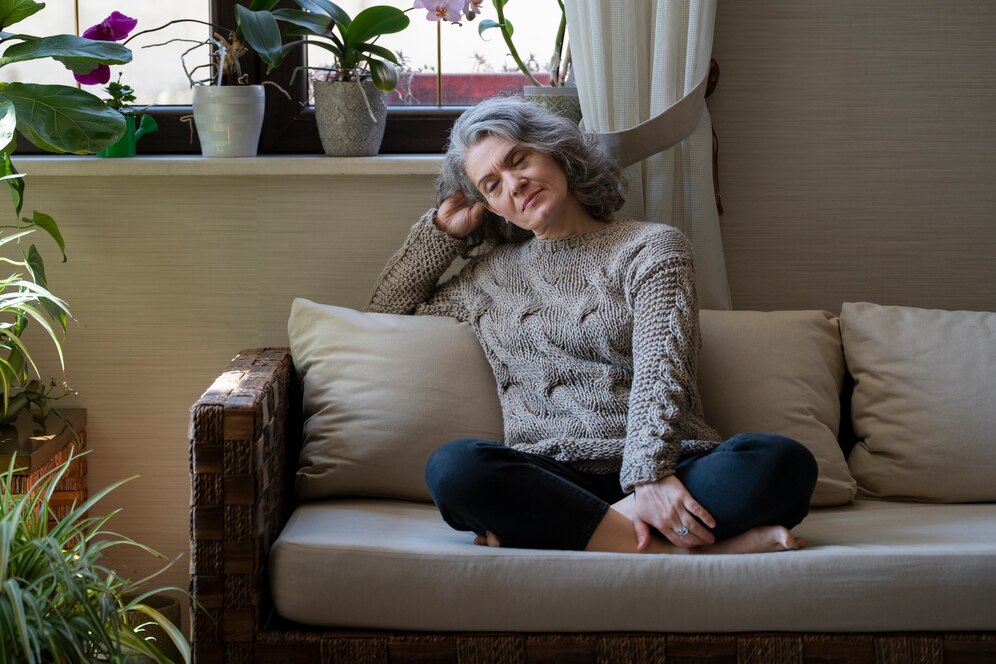 sad-elder-woman-sofa_23-2149403967.jpg