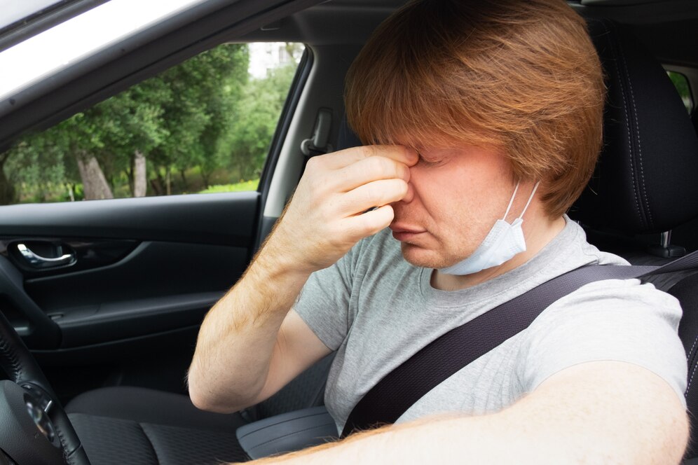 sleepy-exhausted-car-driver-taking-off-medical-mask_74855-5680.jpg